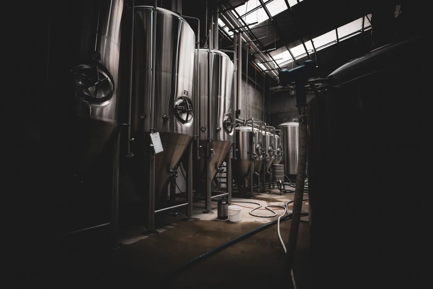 Stainless steel processing tanks in an industrial facility